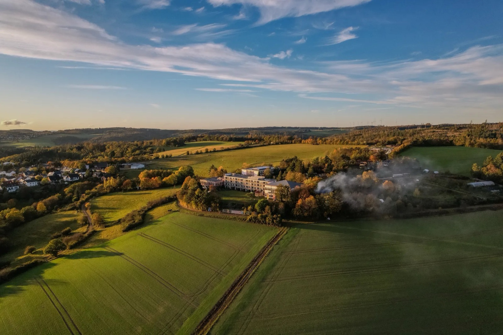 Aerial view of Shree Peetha Nilaya among fields and forest